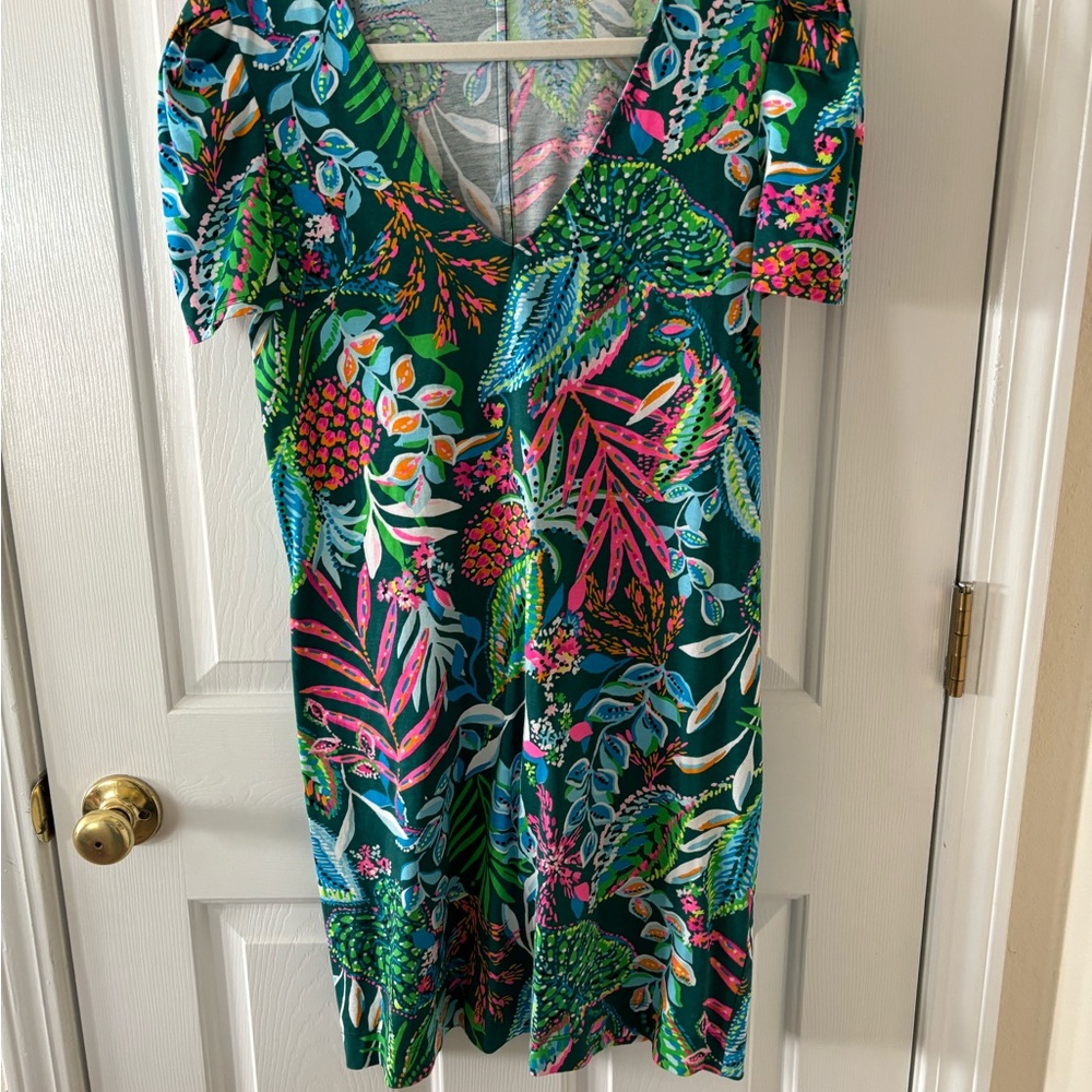 Cute multicolored knit cotton fabric. Slight puff in sleeves V neck .